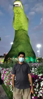 MY PIC TAKEN BEFORE A HUGE ANIMAL AT MIRACLE GARDEN DUBAI